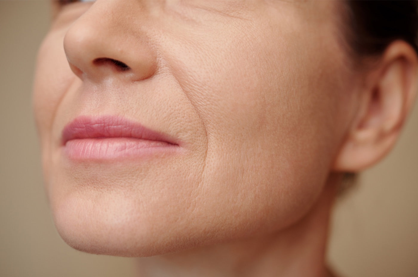 A nasolabial fold running from nose to mouth corner
