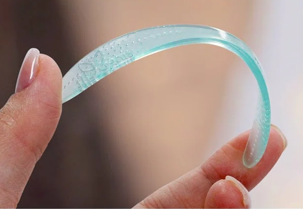 A DermaStrip held between two fingers